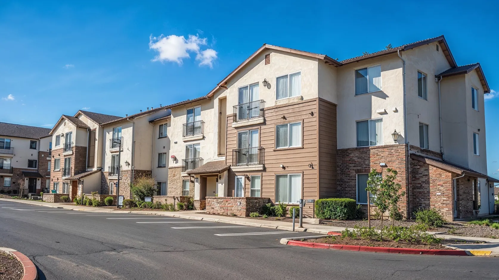 Before condo remodeling project in Los Angeles with dated multifamily exterior, older facade materials, traditional windows, and outdated property appearance