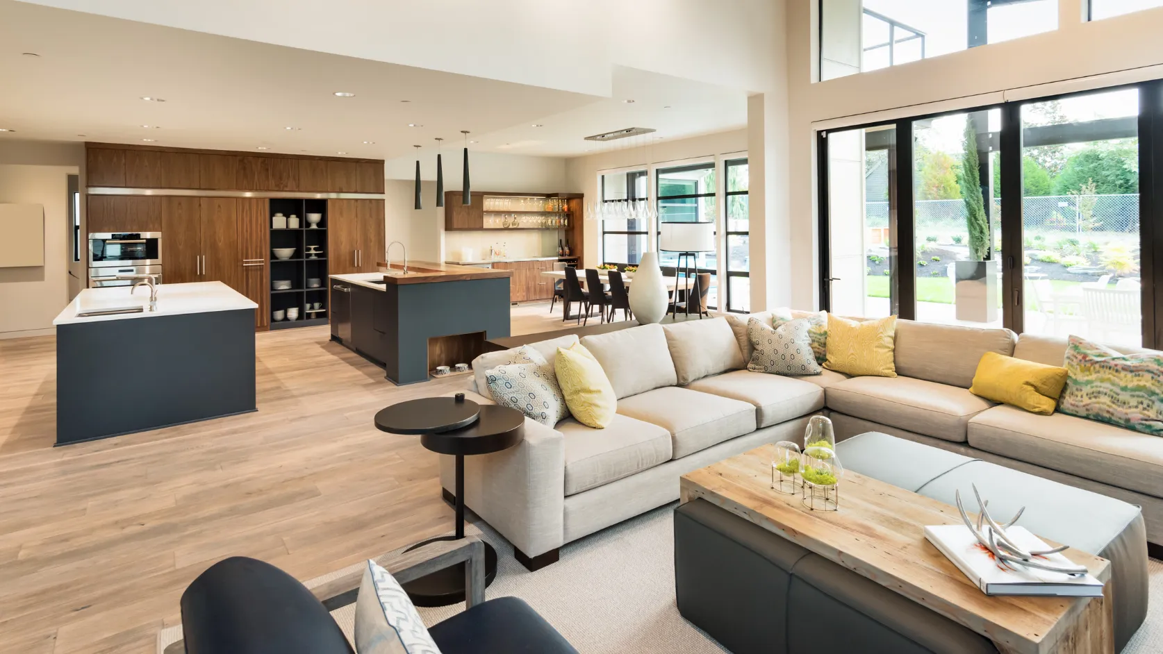 After home remodeling project in Los Angeles with open concept kitchen living room custom cabinets and large windows