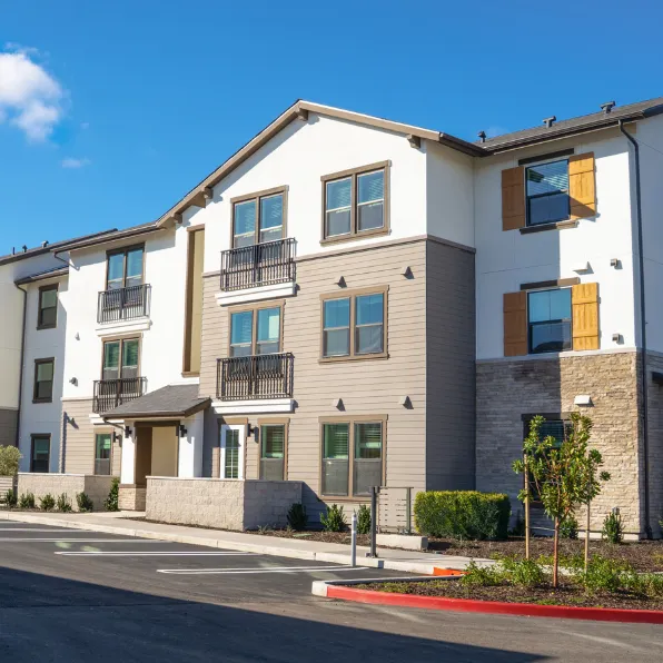 Condo remodeling project in Los Angeles with updated multifamily exterior, modern windows, balconies, stone details, and clean residential property improvements