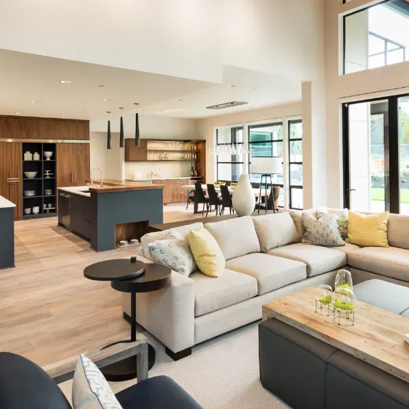 Home remodeling project in Los Angeles with open concept living room, modern kitchen, large windows, wood flooring, and premium interior finishes