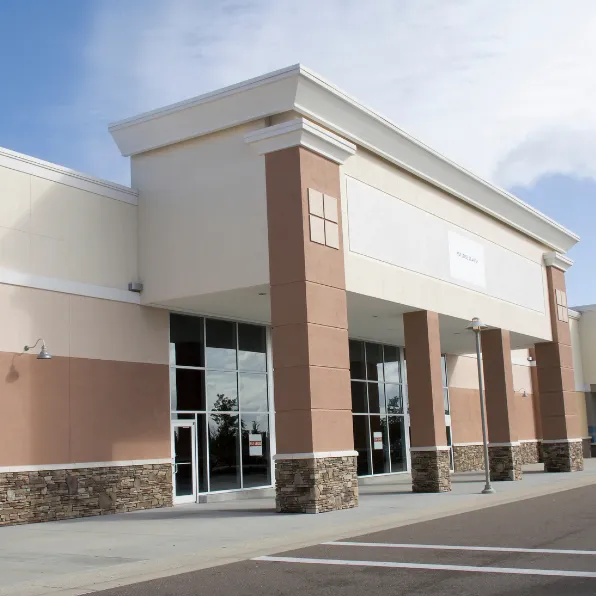 Retail remodeling project in Los Angeles with commercial storefront exterior, glass entry doors, stone columns, clean facade, and customer-facing business upgrades
