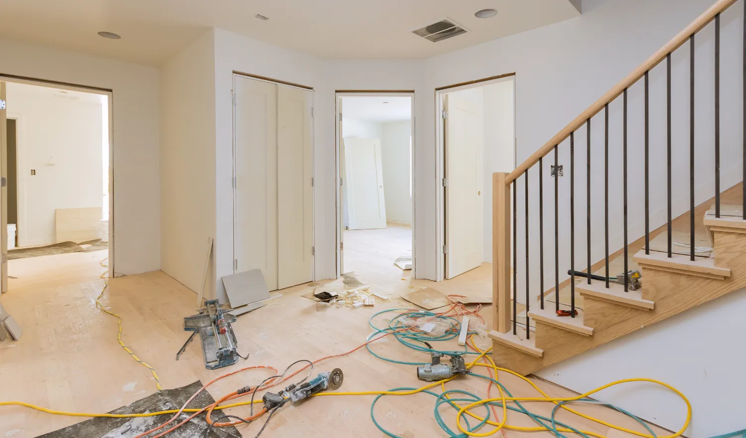 Interior remodeling in Los Angeles with staircase updates, hardwood flooring, trim installation, and whole-interior finish work