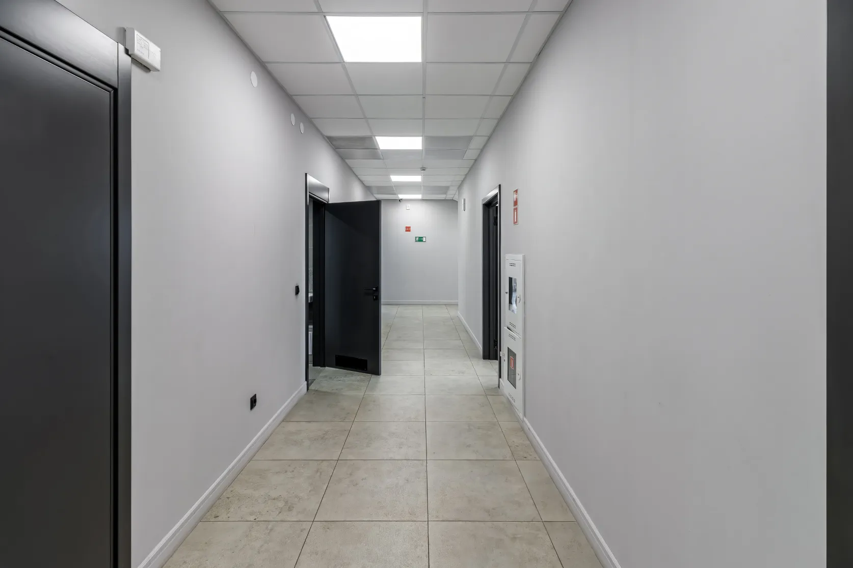 Condo remodeling in Los Angeles with interior hallway flooring, modern doors, wall finishes, lighting updates, and multi-unit property renovation details