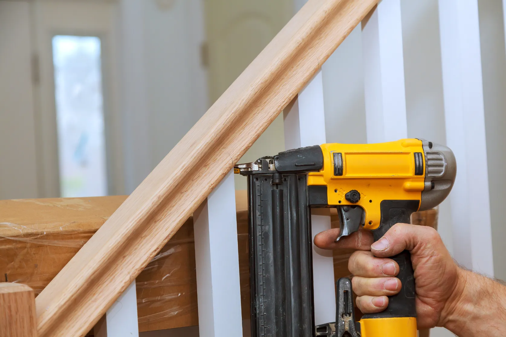 Condo remodeling in Los Angeles with stair railing finish carpentry, trim installation, wood detail work, and interior upgrade preparation