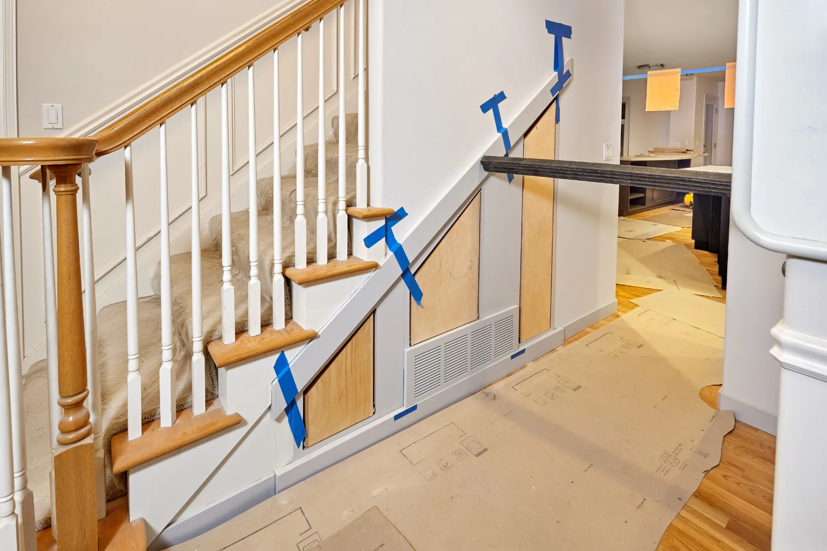 Los Angeles condo remodeling project with staircase updates, hallway protection, under-stair finish work, and interior renovation details