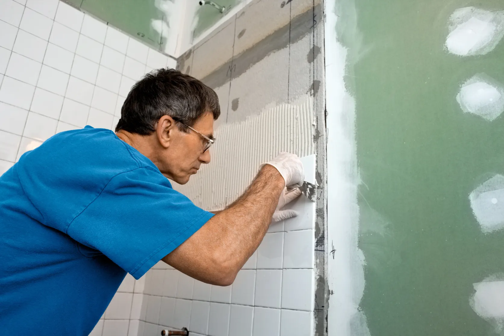 Full home remodeling in Los Angeles with tile installation, drywall repair, wall preparation, and interior renovation details