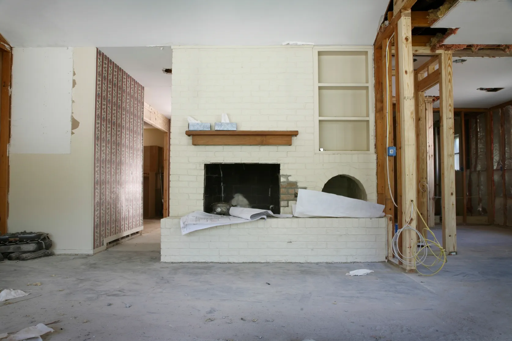 Los Angeles home remodeling project with living room framing, fireplace renovation, exposed walls, and interior construction preparation