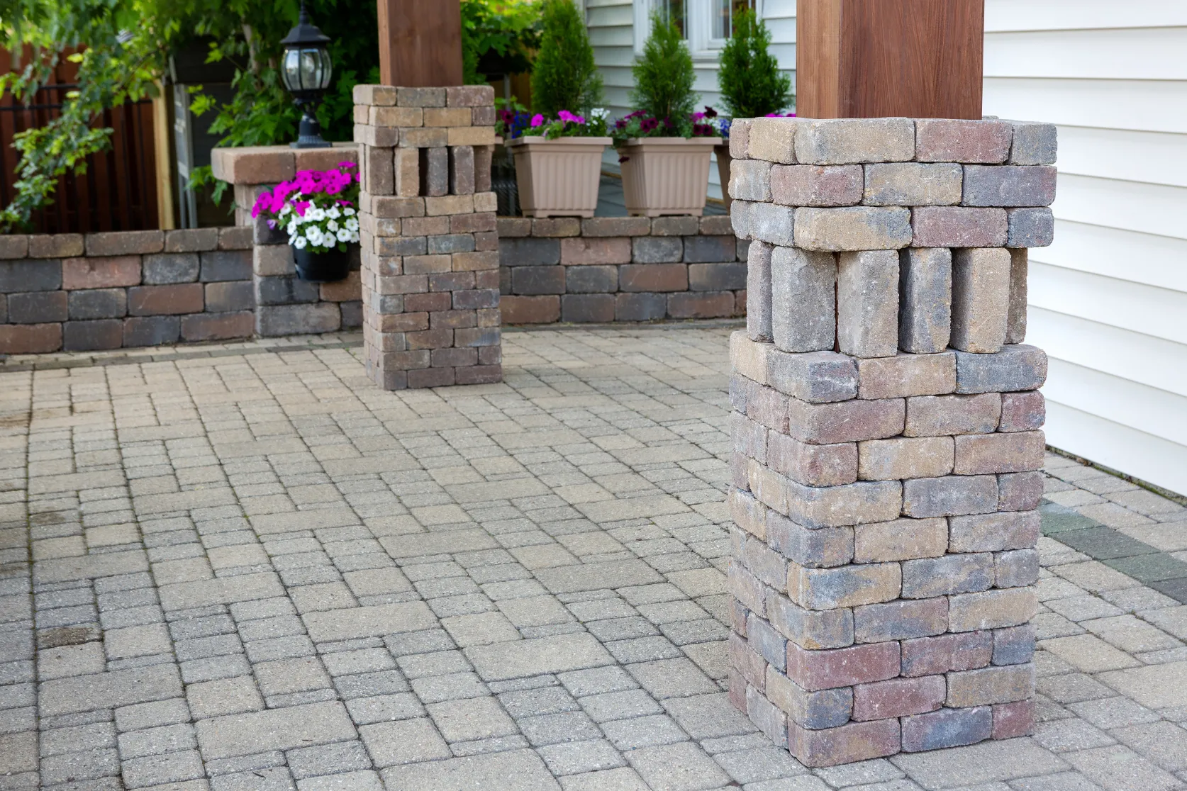 Outdoor living remodeling in Los Angeles with paver patio installation, stone columns, covered outdoor living details, and backyard hardscape upgrades