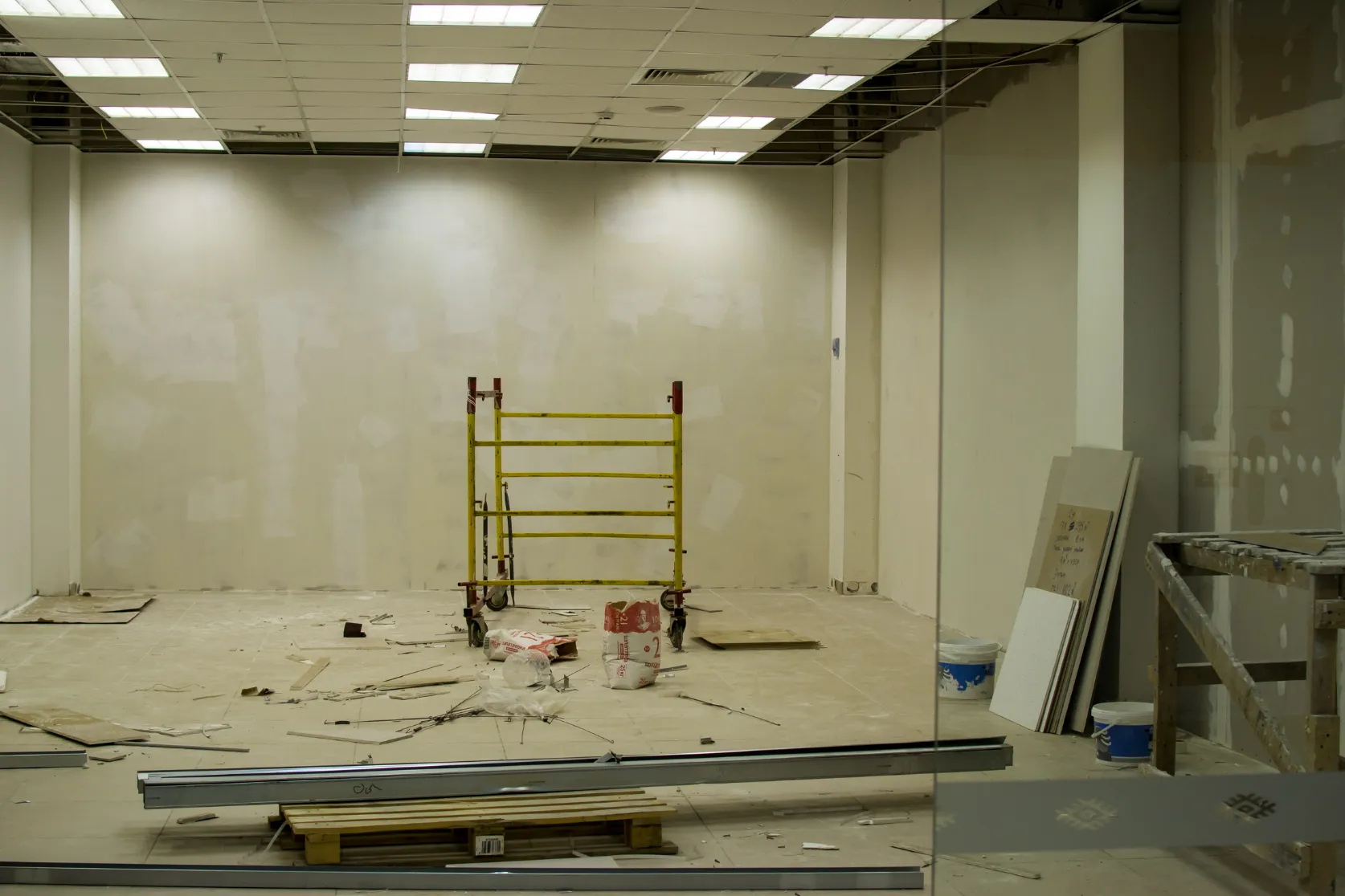 Retail remodeling in Los Angeles with storefront interior buildout, drywall preparation, ceiling tile updates, glass entry, and commercial renovation work